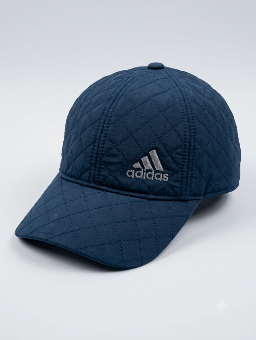 Navy blue quilted baseball cap with diamond stitching, product detail view