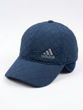Navy blue quilted baseball cap with diamond stitching, front three-quarter view