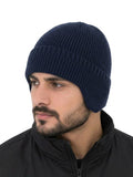 Men's navy blue ribbed knit winter beanie worn on model